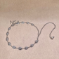Intricate detailed oval pearl inset chain belt